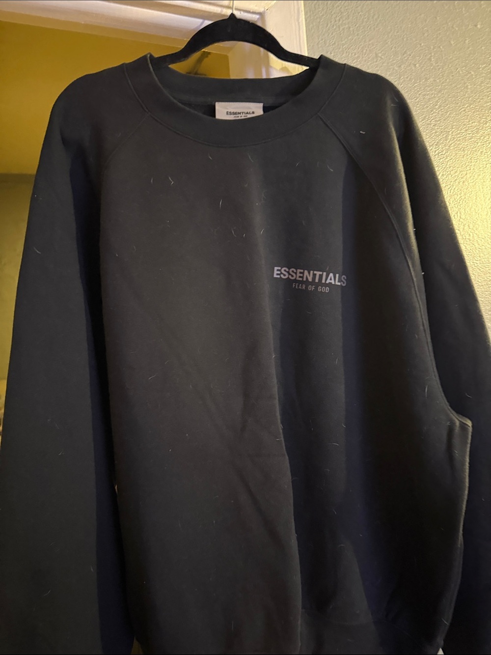 Essentials Black Crewneck Sweatshirt with Subtle Chest Logo